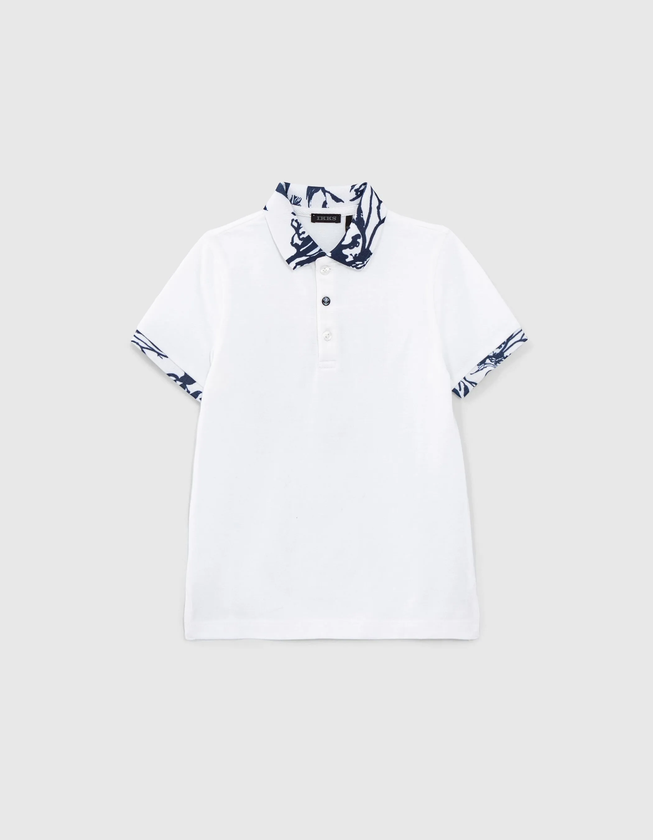 Polo blanc coton bio motif coraux sur bords-côtes garçon