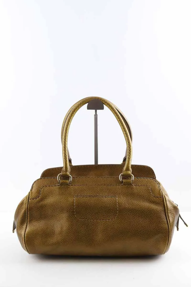 Sac à main en cuir  Tod's doré. Matière principale cuir.